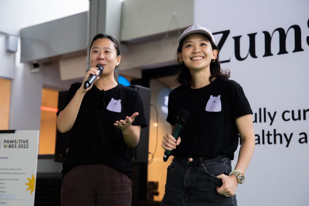 Zumvet founders speaking to their customers on stage